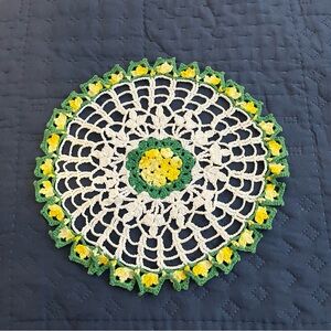 Vintage crocheted doily in traditional double crochet stitch measuring 91/2”.